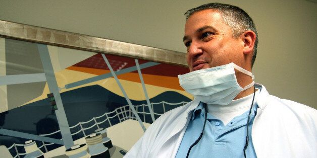 FILE - In this photo dated May 16, 2009 Dutch dentist, Jacobus Van Nierop, is pictured in his dental office in Chateau-Chinon, France. A French court found a Dutch dentist guilty of assault and fraud Tuesday and sentenced him to eight years in prison. (AP Photo/Christophe Masson, File) FRANCE OUT