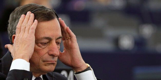European Central Bank President Mario Draghi adjusts his earphones as he attends a debate on the ECB Annual Report for 2014, at the European Parliament in Strasbourg, France, February 1, 2016. REUTERS/Vincent Kessler