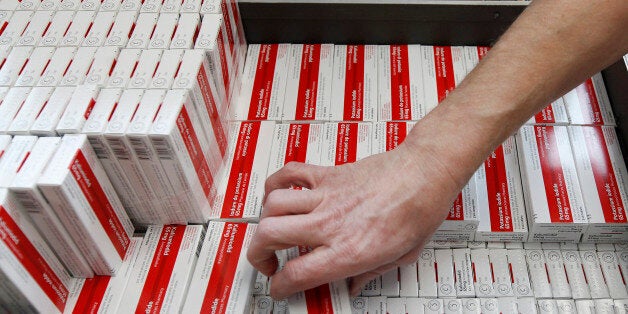 Swiss Agency for Development and Cooperation (DEZA) workers pack iodine tablets at the DEZA logistic - centre in Wabern March 14, 2011, to send for the Swiss embassy in Japan. REUTERS/Pascal Lauener (SWITZERLAND)