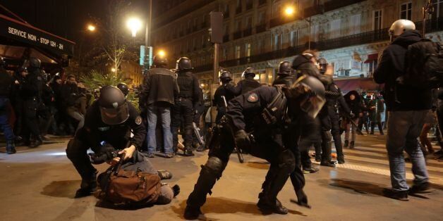 French Gendarmerie detain a man as they clear the Place de la Republique in Paris during a protest by the Nuit Debout, or 'Up All Night' movement who have been rallying against the French government's proposed labour reforms early on April 29, 2016. Twenty-seven people were arrested and 24 detained during the overnight clashes in the French capital as the police dispersed the protesters who began their began movement on March 31 in opposition to the government's proposed labour reforms. AFP PHOTO / JOEL SAGET / AFP / JOEL SAGET (Photo credit should read JOEL SAGET/AFP/Getty Images)