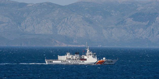 A Turkish coast guard ship patrols on the Aegean Sea, off the Turkish coast on April 20, 2016. The Bonn is part of a NATO naval presence in the Aegean Sea meant to observe and monitor illegal naval movement between Turkey and Greece. / AFP / POOL / JOHN MACDOUGALL (Photo credit should read JOHN MACDOUGALL/AFP/Getty Images)