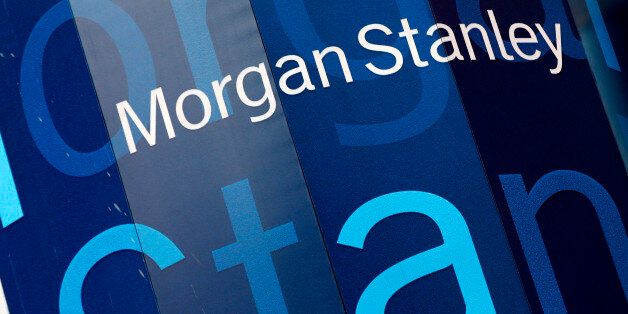The corporate logo of financial firm Morgan Stanley is pictured on the company's world headquarters in the Manhattan borough of New York City, January 20, 2015. Wall Street investment bank Morgan Stanley said it would pay a smaller portion of revenue in bonuses to its bankers and traders this year even in a better revenue environment. The bank reported a drop in fourth-quarter adjusted earnings, missing estimates, as it deferred fewer bonus payouts and unexpected market swings hit its division that trades bonds, currencies and commodities. REUTERS/Mike Segar (UNITED STATES - Tags: BUSINESS LOGO)