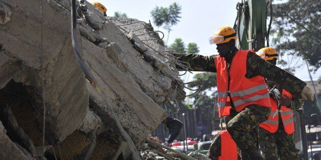 Rescuers search on January 5, 2015 for victims in the rubble of a six-storey residential building that collapsed on January 4 in Nairobi, killing at least two people and injuring several others. Nairobi county official Tom Odongo said the six floors of the building were all occupied and a seventh was under construction. He also said the upper floors were built in quick succession, putting pressure on the lower floors, and added that the construction had not been permitted by local authorities. AFP PHOTO / SIMON MAINA (Photo credit should read SIMON MAINA/AFP/Getty Images)