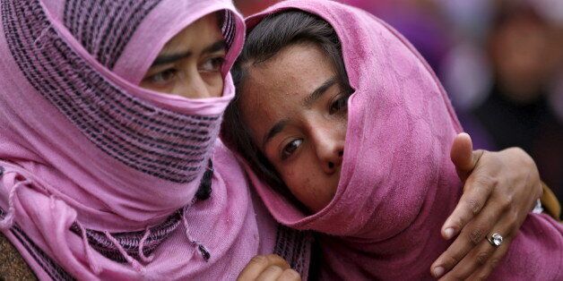 Kashmiri Muslim girls attend the funeral of Bilal Ahamd, a suspected militant, in Karimabad village in south Kashmir April 6, 2016. Ahmad was killed in a gunbattle with Indian security forces on Tuesday evening in south Kashmir, and one residential house was damaged, local media reported. REUTERS/Danish Ismail