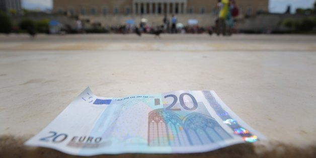 ATHENS, GREECE - JULY 06: In this photo illustration a 20 Euro note sits on the steps of the Greek Parliament on July 6, 2015 in Athens, Greece. Politicians in Europe and Greece are planning emergency talks after Greek voters rejected EU proposals to pay back it's creditors creating an uncertain future for Greece. (Photo illustration by Christopher Furlong/Getty Images)