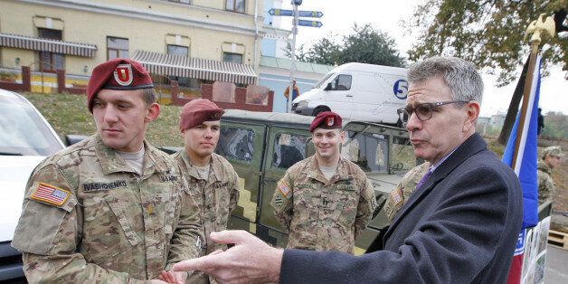 KIEV, UKRAINE - 2015/10/14: US Ambassador to Ukraine Geoffrey Pyatt (R) speaks with the American servicemen during the opening of the exhibition of military equipment called ''The strength of the unconquered '',on the occasion of the Defender of the Fatherland Day,on the Mikhailovskaya square. (Photo by Vasyl Shevchenko/Pacific Press/LightRocket via Getty Images)