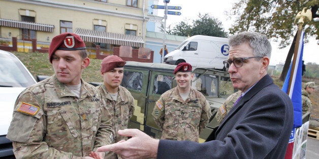 KIEV, UKRAINE - 2015/10/14: US Ambassador to Ukraine Geoffrey Pyatt (R) speaks with the American servicemen during the opening of the exhibition of military equipment called ''The strength of the unconquered '',on the occasion of the Defender of the Fatherland Day,on the Mikhailovskaya square. (Photo by Vasyl Shevchenko/Pacific Press/LightRocket via Getty Images)