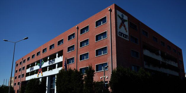 A view of the OPAP building, Greece's state lottery monopoly in Athens on September 21, 2012. Greece on September 19 scrapped tax perks for state-controlled betting agency Opap, which is among the companies to be privatised under a deal with the country's international lenders. Opap, which used to operate tax-free, would now have to pay taxes at a rate of '30 to 35 percent on gross profits until 2020', the finance ministry said in a statement. AFP PHOTO / ARIS MESSINIS (Photo credit shoul