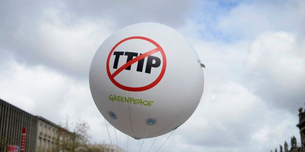 A Greenpeace air ballon with a protest sign is pictured during a demonstration against Transatlantic Trade and Investment Partnership (TTIP) free trade agreement ahead of U.S. President Barack Obama's visit in Hannover, Germany April 23, 2016. REUTERS/Nigel Treblin