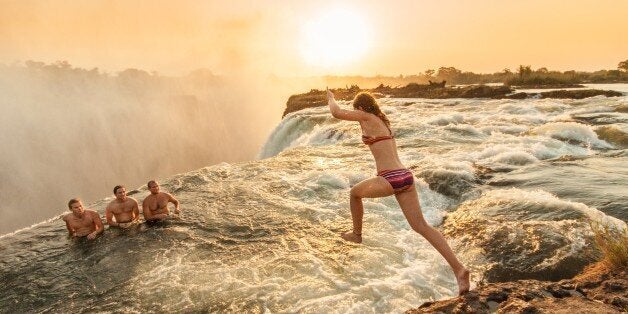 Jumping into devils pool, Victoria falls, Zambia