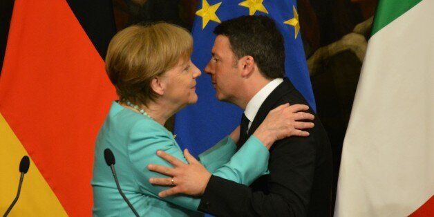 ROME, ITALY - MAY 5: Italian Premier Matteo Renzi (R) and German Chancellor Angela Merkel embrace each other during a press conference after a bilateral meeting, in Rome, Italy, 05 May 2016. (Photo by Baris Seckin/Anadolu Agency/Getty Images)
