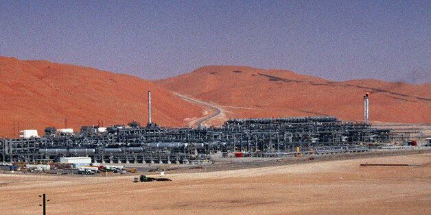 FILE - In this Monday, March 8, 2004 file photo, an industrial plant strips natural gas from freshly pumped crude oil is seen at Saudi Aramco's Shaybah oil field at Shaybah in Saudi Arabia's Rub al-Khali desert. King Salman announced the approval for the