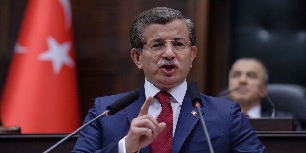 Turkey's Prime Minister Ahmet Davutoglu addresses his lawmakers at the parliament in Ankara, Turkey, Tuesday, May 3, 2016. Long-denied tensions between Turkeyâs president and prime minister are beginning to surface publicly, leading to speculation that the countryâs powerful leader may be considering replacing the premier with a figure more willing to take a backseat role. (AP Photo)