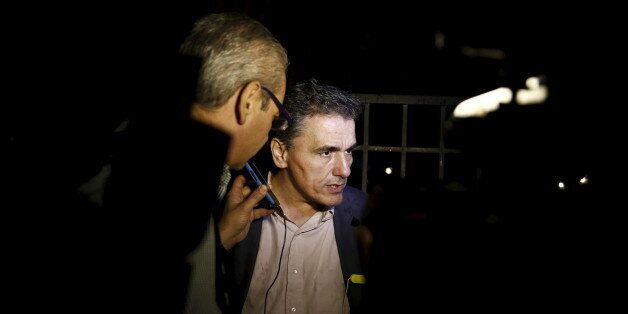 Greece's head negotiator with its lenders Euclid Tsakalotos talks to journalists outside the Maximos Mansion in Athens, Greece June 27, 2015. Greece will hold a referendum on July 5 to decide whether the country should accept or reject a bailout agreement offered by creditors, Prime Minister Alexis Tsipras said in a late-night address to the nation. REUTERS/Alkis Konstantinidis TPX IMAGES OF THE DAY