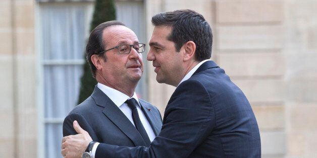 French President Francois Hollande, left, welcomes Greek Prime Minister Alexis Tsipras at the Elysee Palace in Paris, France, Wednesday, April 13, 2016. Greek Prime Minister Alexis Tsipras meets French President Francois Hollande after talks between Greece and its bailout creditors over the country's next economic reforms efforts. (AP Photo/Michel Euler)