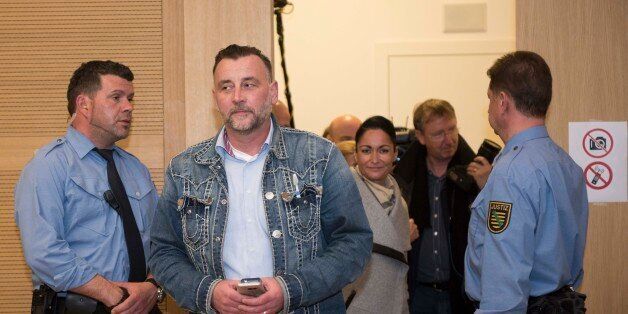 DRESDEN, GERMANY - APRIL 19: Lutz Bachmann, left, founder of the Pegida movement, his wife Vicky, behind, arrive to the courtroom after a break on the first day of his trial to face charges of hate speech on April 19, 2016 in Dresden, Germany. Bachmann is accused of rabble-rousing.The charges stem from Bachmann's Facebook descriptions of arriving refugees in Germany as 'garbage,' animals' and 'scum' and that he thereby incited his followers to hatred. The Pegida movement, which sees refugees as a threat to German society, has been especially popular in eastern Germany and holds weekly gatherings in Dresden. (Photo by Matthias Rietschel/Getty Images)