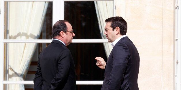 PARIS, FRANCE - MARCH 12: French President Francois Hollande speaks with Greek Prime minister, Alexis Tsipras after a family photo at the Elysee Presidential Palace on March 12, 2016 in Paris, France. Francois Hollande met the European social democratic leaders on the future of the European Union. (Photo by Chesnot/Getty Images)