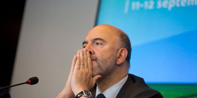 European Commissioner for the Economy Pierre Moscovici pauses before speaking during a media conference after a meeting of European finance ministers at the European Council building in Luxembourg on Friday, Sept. 11, 2015. European Union finance ministers and central bankers hold informal talks in Luxembourg Friday to discuss taxation and ways to further deepen cooperation on the EUâs euro single currency. (AP Photo/Virginia Mayo)