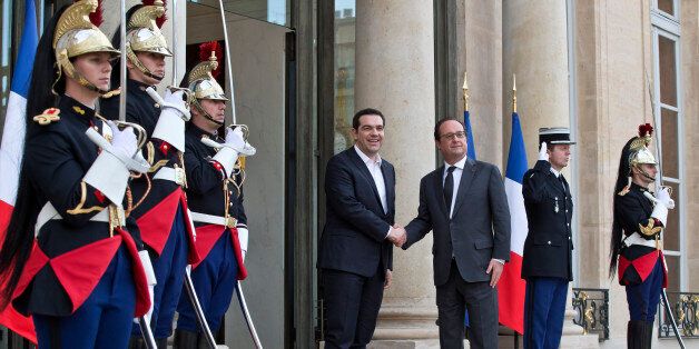 Greek Prime Minister Alexis Tsipras, left, is welcomed by French President Francois Hollande at the Elysee Palace in Paris, France, Wednesday, April 13, 2016. Greek Prime Minister Alexis Tsipras meets French President Francois Hollande after talks between Greece and its bailout creditors over the country's next economic reforms efforts. (AP Photo/Michel Euler)