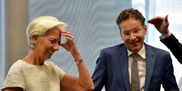 International Monetary Fund Managing Director Christine Lagarde and Eurogroup President Jeroen Dijsselbloem take part in a euro zone EU leaders summit on the situation in Greece, in Brussels, Belgium, July 11, 2015. Skeptical European finance ministers gathered on Saturday to decide whether to negotiate a third bailout for Greece after Prime Minister Alexis Tsipras won lawmakers' backing for painful austerity measures his leftist party was elected to prevent. REUTERS/Eric Vidal.