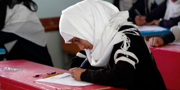 A Yemeni female student sits for the mid-year school exams at a secondary school on February 9, 2016 in the capital Sanaa. / AFP / MOHAMMED HUWAIS (Photo credit should read MOHAMMED HUWAIS/AFP/Getty Images)