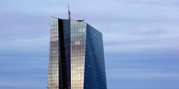 Top of the 'Seat of the European Central Bank' skyscraper illuminated at dusk