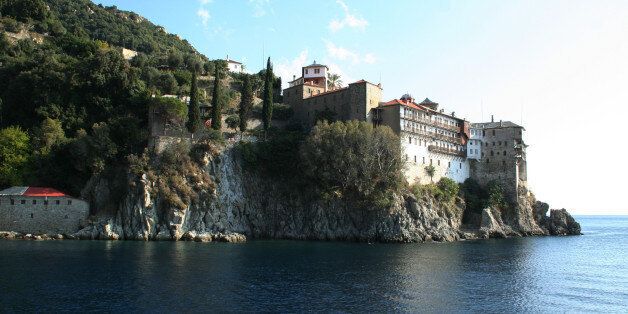 A general view of Gregoriou Monastery in Orthodox monastic community of Mount Athos October 22, 2008. Mount Athos is like nowhere on earth. Despite protests from the European parliament, women are still banned from the rugged 300 sq Km (115.8 sq mile) peninsula, dedicated to the Virgin Mary since 1060. Athos still uses the MEdieval Julian calendar, running 13 days behind the modern Gregorian one. Days begin at sunset with vespers and after a few hours sleep, prayers restart at 3 a.m. Picture ta