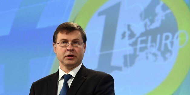 European commissioner for the Euro and social dialogue Valdis Dombrovskis holds a press conference on 'Completing Europe's Economic and Monetary Union - Moving ahead under Stage 1' at the European Commission in Brussels on October 21, 2015. AFP PHOTO / EMMANUEL DUNAND (Photo credit should read EMMANUEL DUNAND/AFP/Getty Images)
