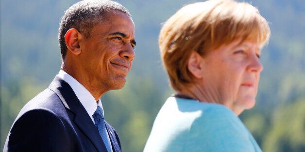U.S. President Barack Obama and German Chancellor Angela Merkel make speeches after signing the guest book in Kruen, Germany June 7, 2015. Leaders from the Group of Seven (G7) industrial nations met on Sunday in the Bavarian Alps for a summit overshadowed by Greece's debt crisis and ongoing violence in Ukraine. REUTERS/Matthias Schrader/Pool
