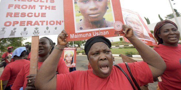 Members of Bring Back Our Girls movement carry plarcards with pictures to press for the release of the missing Chibok schoolgirls in Lagos, on April 14, 2016. Nigeria's government said it was studying a 'proof of life' video showing 15 of the more than 200 schoolgirls abducted by Boko Haram, as parents and their supporters marked the second anniversary of the kidnapping. A total of 276 girls were abducted from the Government Girls Secondary School in Chibok, northeast Nigeria, on April 14, 2014. Fifty-seven escaped in the immediate aftermath. / AFP / PIUS UTOMI EKPEI (Photo credit should read PIUS UTOMI EKPEI/AFP/Getty Images)