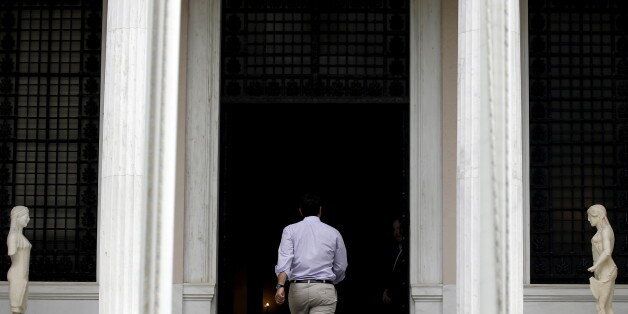 Greek Prime Minister Alexis Tsipras arrives at his office in Athens, Greece July 11, 2015. Tsipras won backing from lawmakers on Saturday for painful reforms but it remained unclear it would be enough to secure a bailout from German and other euro zone ministers meeting in Brussels. REUTERS/Yannis Behrakis