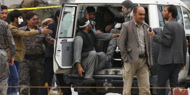 ATTENTION EDITORS - VISUAL COVERAGE OF SCENES OF INJURY OR DEATH Afghan security forces transport injured security personnel after a suicide car bomb attack in Kabul, Afghanistan April 19, 2016. REUTERS/Mohammad Ismail