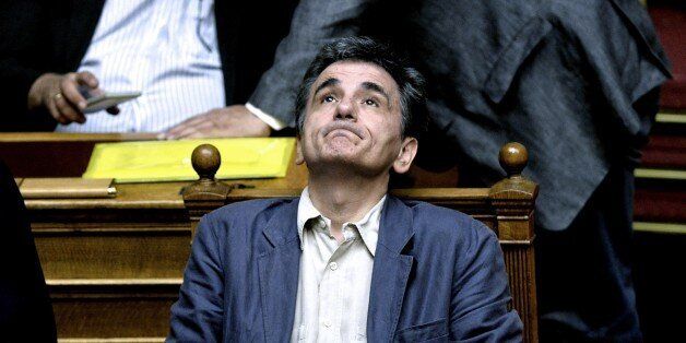 Greek Finance Minister Euclid Tsakalotos attends a parliament session in Athens, on July 15, 2015. Greece geared up for a parliamentary vote on draconian reforms demanded by eurozone creditors in exchange for a huge new bailout, just hours after a bombshell report from the International Monetary Fund criticised the deal. AFP PHOTO / ANGELOS TZORTZINIS (Photo credit should read ANGELOS TZORTZINIS/AFP/Getty Images)