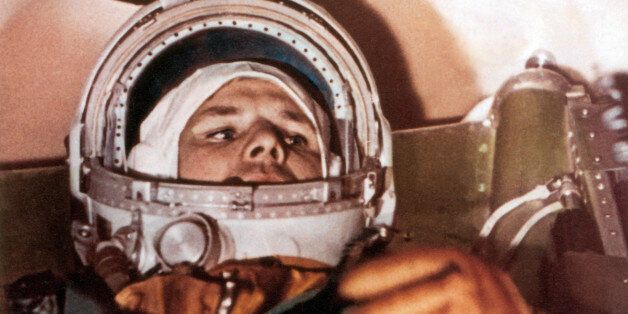 Yuri Gagarin (1934-1968), Soviet cosmonaut and first man in space, in the capsule of the Vostok 1 spacecraft. Gagarin made the first manned space flight on 12 April 1961. He orbited the Earth once in the Vostok 1 spacecraft, a flight that lasted 1 hour and 48 minutes. Gagarin became a hero in the Soviet Union and famous worldwide. He later returned to active service as a test pilot, dying in a crash during a training flight in 1968. His ashes were interred with full military honors in the Kremlin Wall. Photographed on 12th April 1961.