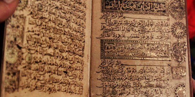 This is a handwritten manuscript of the Qurran by Ibn al-Bawab, a renowned seventh century caligraphist, shown at the new Biblioteca Alexandrina library in Alexandria, Egypt Wednesday, August 1, 2001. The book was the first placed on the shelves of the library during a ceremony Wednesday. The library will officially open its doors to the public on April 23, 2002. (AP Photo/Amr Nabil)