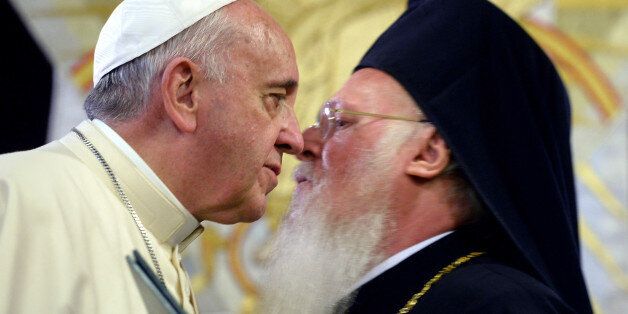 Pope Francis, left, and Ecumenical Patriarch Bartholomew I greet each other after issuing a joint declaration, in Istanbul, Sunday, Nov. 30, 2014. Pope Francis and the spiritual leader of the world's Orthodox Christians, Ecumenical Patriarch Bartholomew I, issued a joint declaration Sunday at the end of Francis' visit to Turkey during which the pope prayed in one of Istanbul's most important mosques. They wrote:
