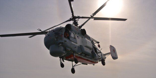 A Russian navy helicopter takes off from the deck of the Russian destroyer Vice Admiral Kulakov on patrol in eastern Mediterranean on Thursday, Jan. 21, 2016. Russian warships equipped with an array of long-range missiles cruise off Syria's coast to back the air campaign in Syria and project Moscow's naval power in the Mediterranean. (AP Photo/Vladimir Isachenkov)