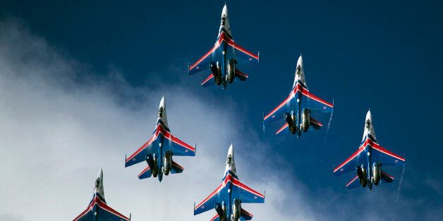 Su-27 jets of aerobatics team Russkiye Vityasy, or Russian Knights, perform during the MAKS-2015 International Aviation and Space Show in Zhukovsky, outside Moscow, Russia, Sunday, Aug. 30, 2015. (AP Photo/Pavel Golovkin)