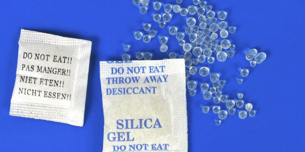 Macro of silica gel bags on blue background