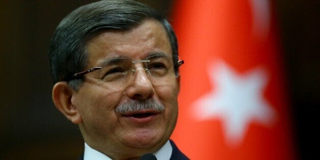 ANKARA, TURKEY - APRIL 5: Turkish Prime Minister and the leader of the Justice and Development Party (AK Party) Ahmet Davutoglu delivers a speech during AK Party's group meeting at the Grand National Assembly of Turkey (TBMM) in Ankara, Turkey on April 5, 2016. (Photo by Volkan Furuncu/Anadolu Agency/Getty Images)