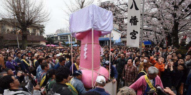 People crowd outside the Wakamiya Hachimangu Shrine to see portable shrines bearing phalluses during the Kanamara Festival in Kawasaki, a suburb of Tokyo on April 3, 2016. More than 20,000 people gathered to enjoy the annual festival which Shinto believers carry giant phalluses through the streets. / AFP / TORU YAMANAKA (Photo credit should read TORU YAMANAKA/AFP/Getty Images)