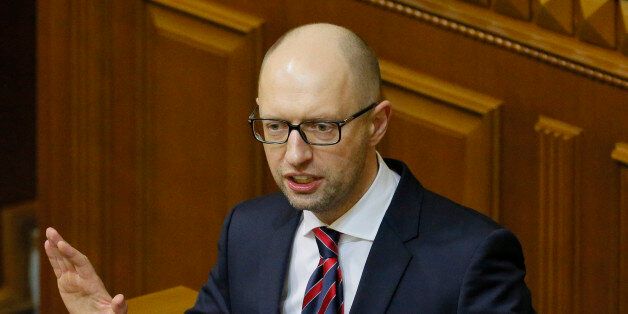Ukrainian Prime Minister Arseniy Yatsenyuk speaks during an annual report in Parliament in Kiev, Ukraine, Tuesday, Feb. 16, 2016. Ukraineâs Prime Minister faces a possible no-confidence vote during a parliamentary session, which could remove him from office. (AP Photo/Sergei Chuzavkov)