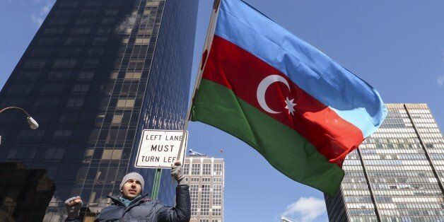 NEW YORK, NY - FEBRUARY 26: Azerbaijani and Turkish citizens gathered in front of the Permanent Mission of Armenia to the United Nations (UN) stage a protest during the 24th anniversary of Khojaly Massacre in New York on February 26, 2016. The massacre on February 25-26, 1992, is regarded as one of the bloodiest and most controversial incidents of the war between Armenia and Azerbaijan for control of the Nagorno-Karabakh region. (Photo by Bilgin S. Sasmaz/Anadolu Agency/Getty Images)