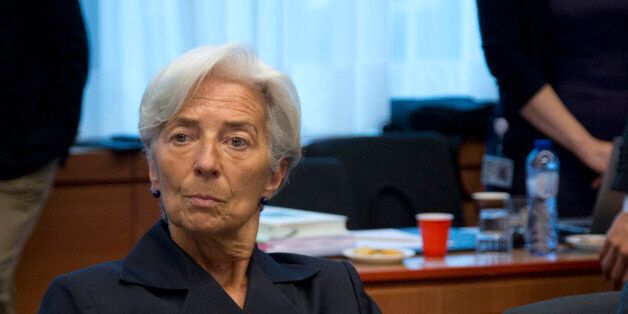 Managing Director of the International Monetary Fund Christine Lagarde waits for the start of a meeting of eurogroup finance ministers in Brussels on Saturday, June 27, 2015. Anxiety over Greece's future swelled on Saturday after Prime Minister Alexis Tsipras' call to have the people vote on a proposed bailout deal. (AP Photo/Virginia Mayo)