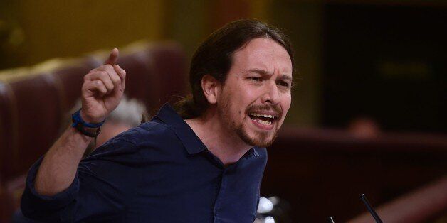 Leader of the left wing party Podemos, Pablo Iglesias gestures during a debate at the Spanish parliament ('Las Cortes') in Madrid on April 6, 2016. / AFP / PIERRE-PHILIPPE MARCOU (Photo credit should read PIERRE-PHILIPPE MARCOU/AFP/Getty Images)