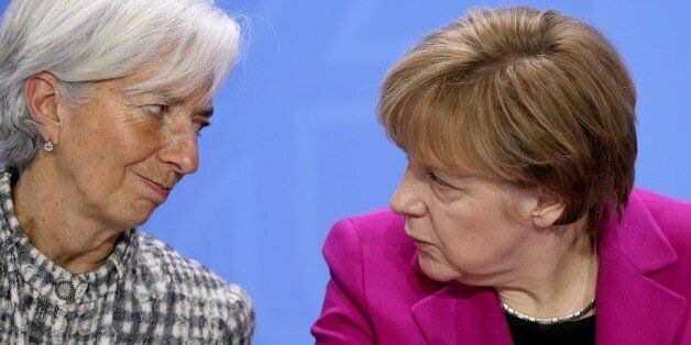 BERLIN, GERMANY - MARCH 11: German Chancellor Angele Merkel (R) and Managing Director (MD) of the International Monetary Fund (IMF) Christine Lagarde (L) attend a press conference after a meeting at the German federal Chancellery on March 11, 2015 in Berlin, Germany. (Photo by Mehmet Kaman/Anadolu Agency/Getty Images)