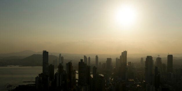 Panama City skyline is silhouette at sunset in Panama, Monday, April 4, 2016. Panama's president says his government will cooperate