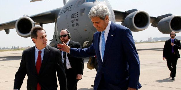 US ambassador to Iraq Stuart Jones (L) walks with Secretary of State John Kerry (R) as he arrives via military transport at Baghdad International Airport in Baghdad on April 8, 2016. / AFP / POOL / JONATHAN ERNST (Photo credit should read JONATHAN ERNST/AFP/Getty Images)