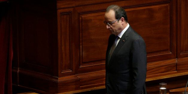 French President Francois Hollande leaves after delivering a speech at the Versailles castle, west of Paris, Monday, Nov.16, 2015. French President Francois Hollande is addressing parliament about France's response to the Paris attacks, in a rare speech to lawmakers gathered in the majestic congress room of the Palace of Versailles. (Philippe Wojazer, Pool via AP)