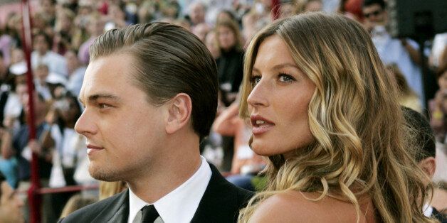 Actor Leonardo DiCaprio (L) and girlfriend Brazilian supermodel Gisele Bundchen arrive at the 77th annual Academy Awards in Hollywood, February 27, 2005. DiCaprio was nominated for best actor for his role in